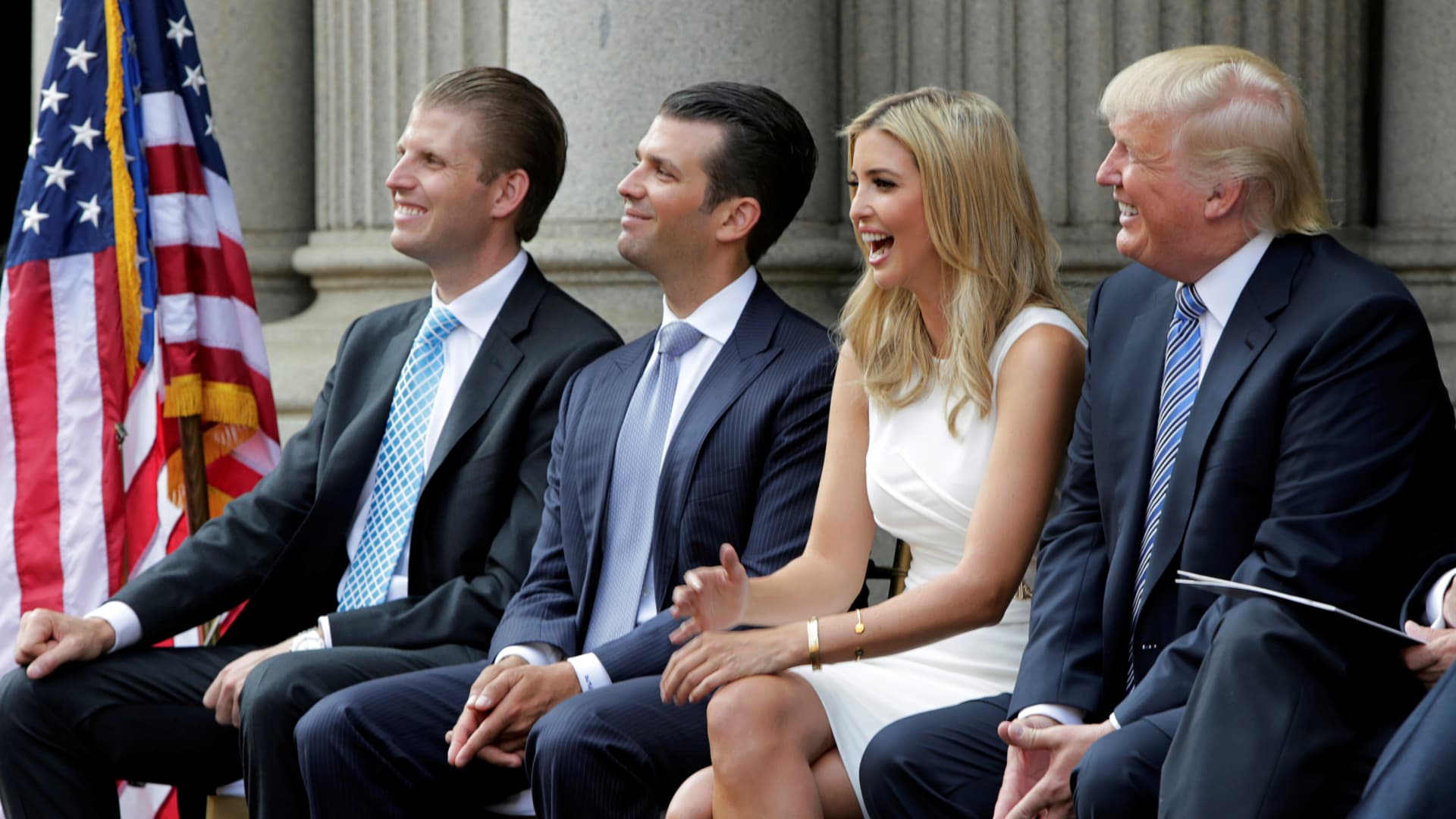 (L-R) Eric Trump, Donald Trump Jr., and Ivanka Trump and Donald Trump attend the ground breaking of the Trump International Hotel at the Old Post Office Building in Washington July 23, 2014.