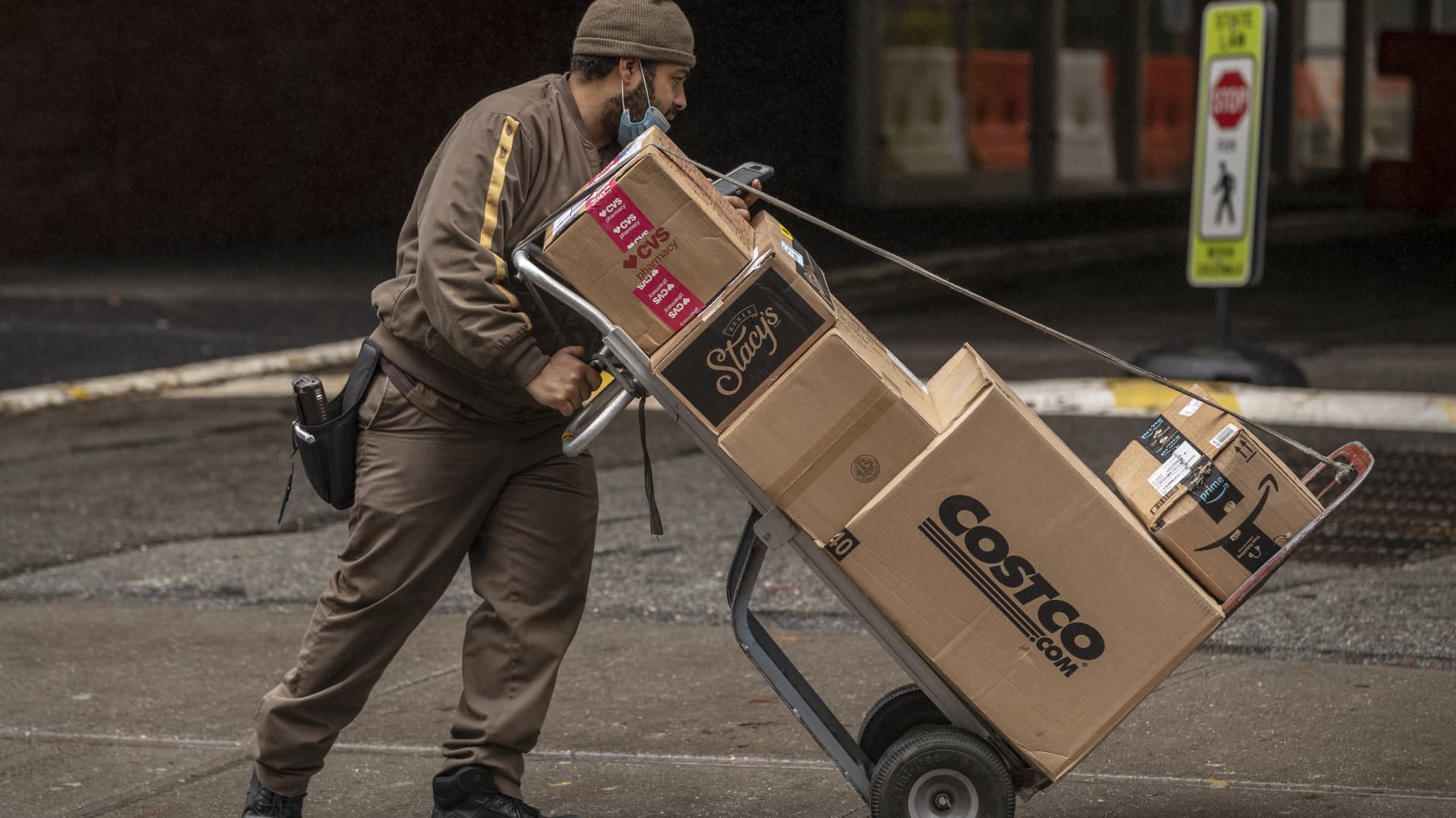 A United Parcel Service Inc. (UPS) driver delivers boxes in New York, U.S., on Tuesday, Oct. 13, 2020.