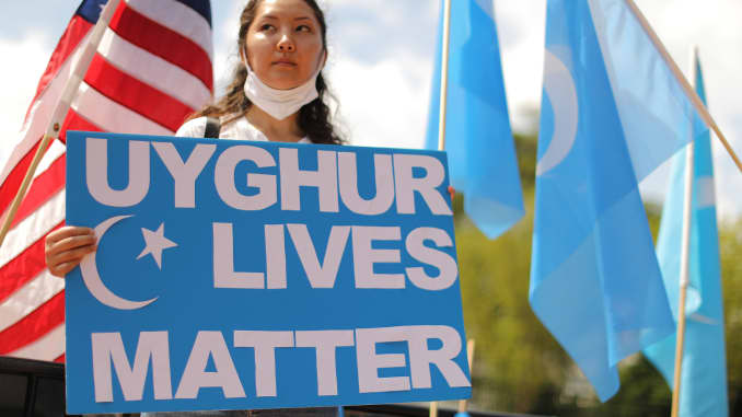 A protester outside the White House urges the United States to take action to stop the oppression of the Uyghur and other Turkic peoples, on August 14, 2020 in Washington, DC.