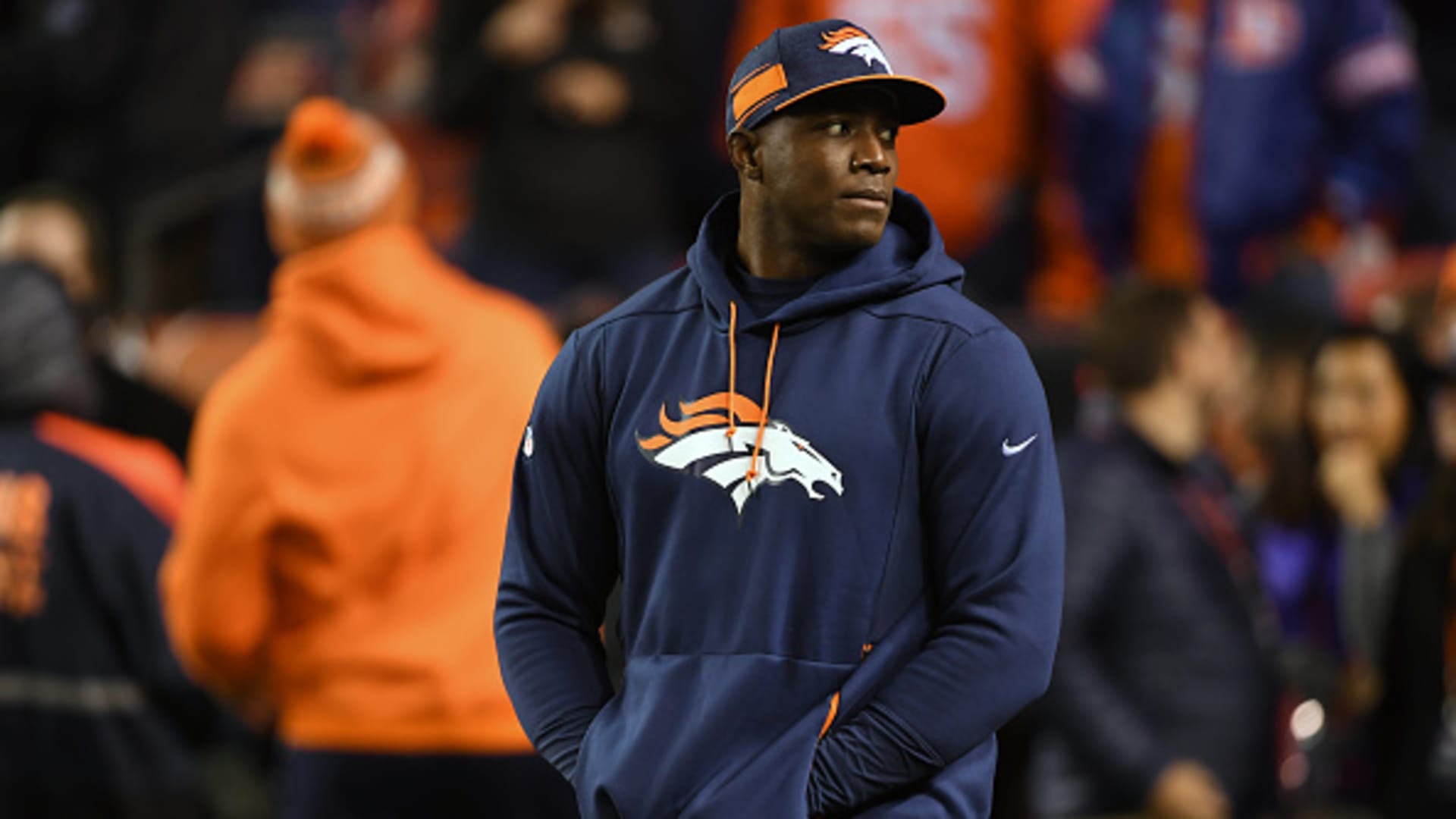Former Bronco DeMarcus Ware on the sidelines before the game as the Denver Broncos played the Cleveland Browns at Broncos Stadium at Mile High.