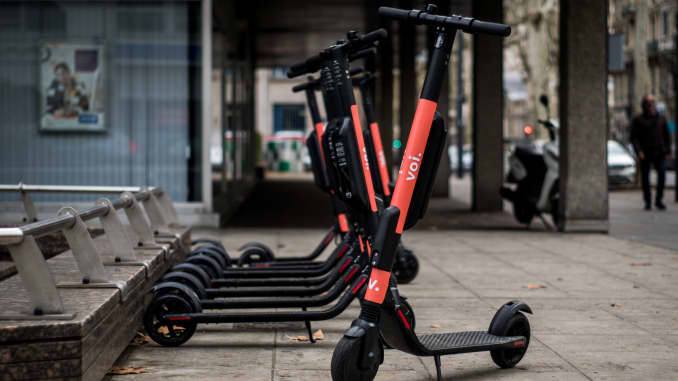 Electric scooters of the brand Voi are parked in the streets of Lyon, France, on February 8, 2019.