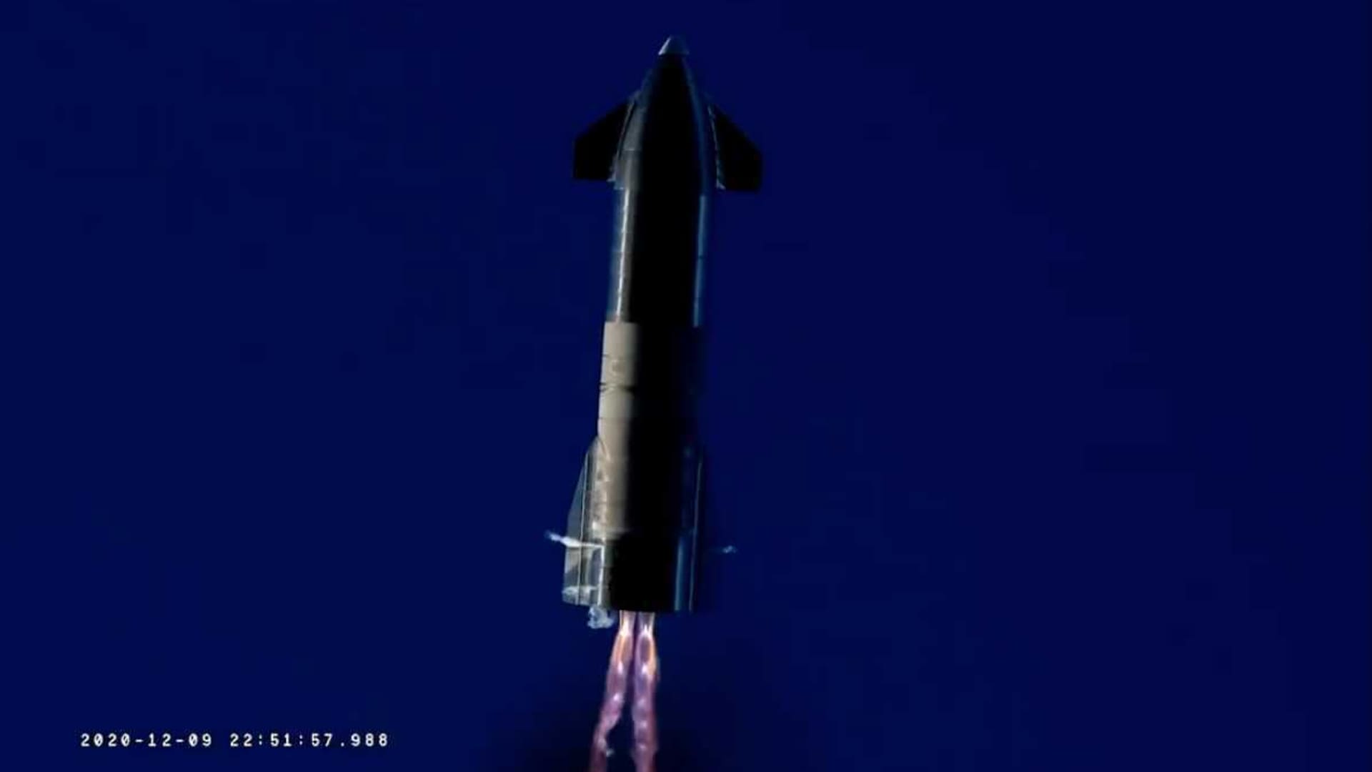 Starship prototype rocket SN8 fires two Raptor engines as it attempts to land after its high-altitude test flight on Dec. 9, 2020.