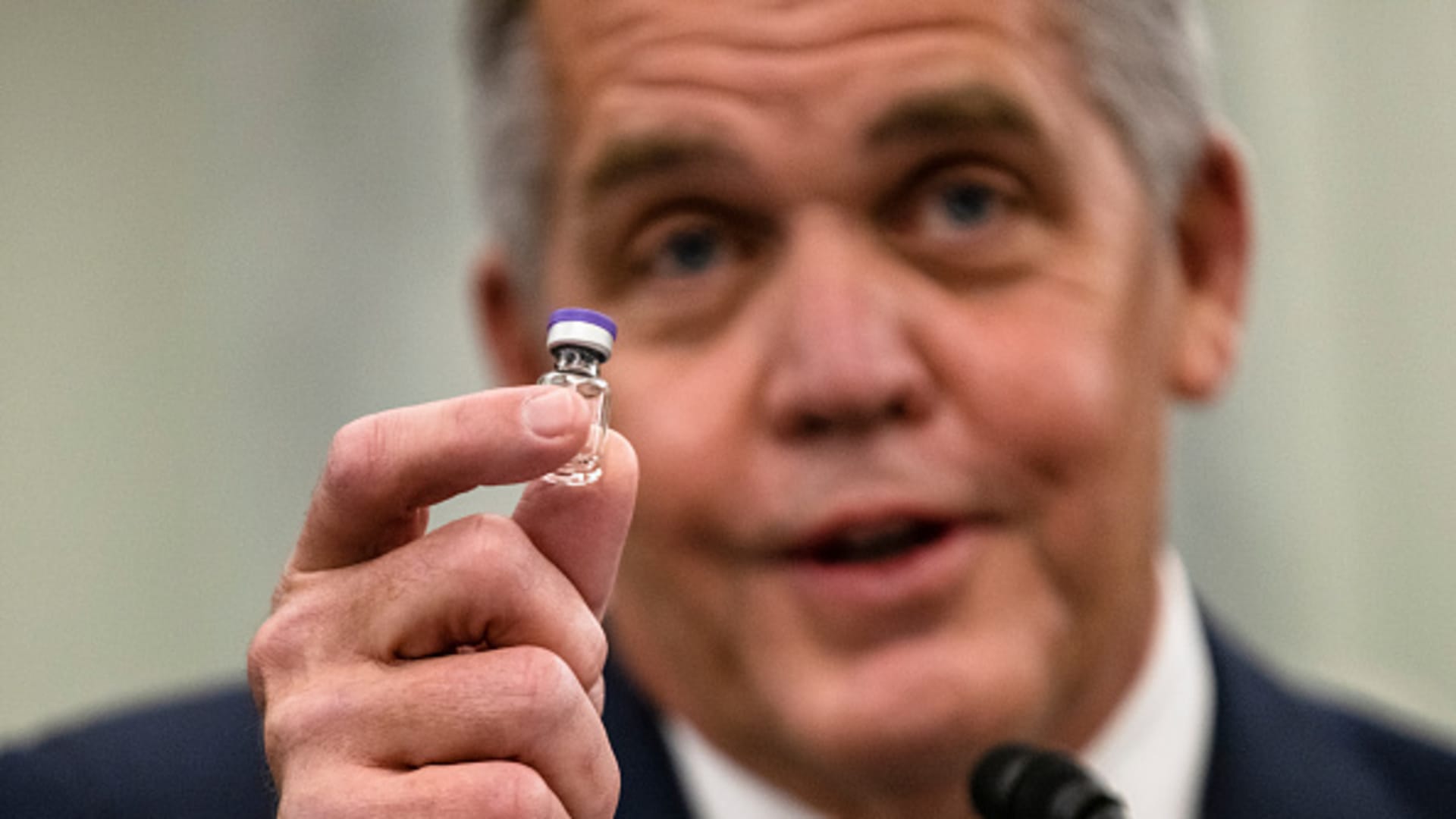 Wesley Wheeler, President of Global Healthcare at United Parcel Service (UPS), holds up a sample of the vial that will be used to transport the Pfizer COVID-19 vaccine as he testifies during a Senate Commerce, Science, and Transportation Subcommittee hearing on the logistics of transporting a COVID-19 vaccine on December 10, 2020 in Washington, DC.