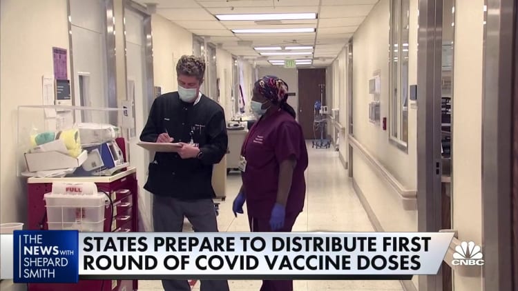 States prepare to distribute first round of Covid vaccines to health-care workers and the most vulnerable