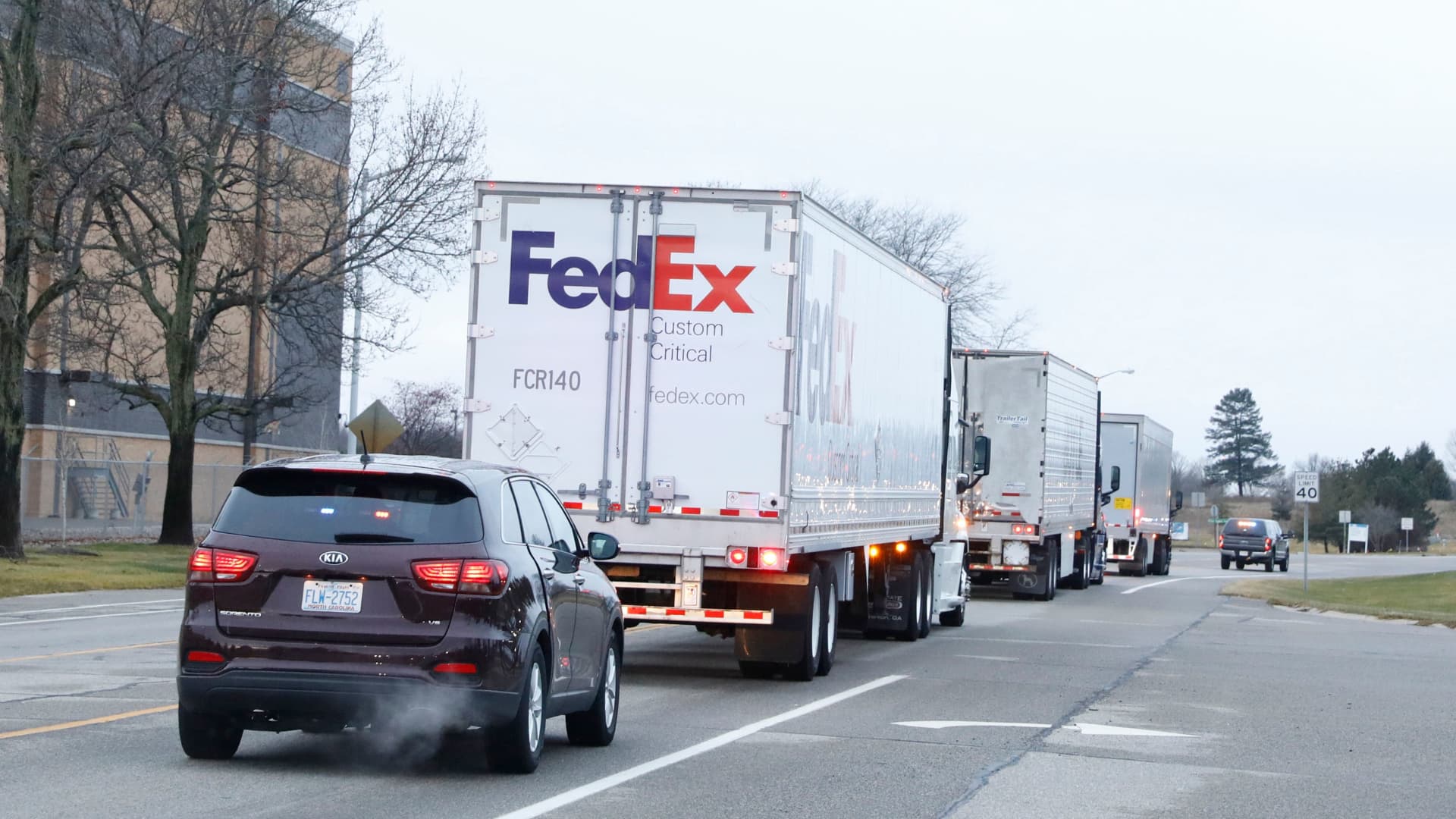 Trucks carrying the first shipment of the Covid-19 vaccine that is being escorted by the US Marshals Service, leave Pfizer's Global Supply facility in Kalamazoo, Michigan on December 13, 2020.