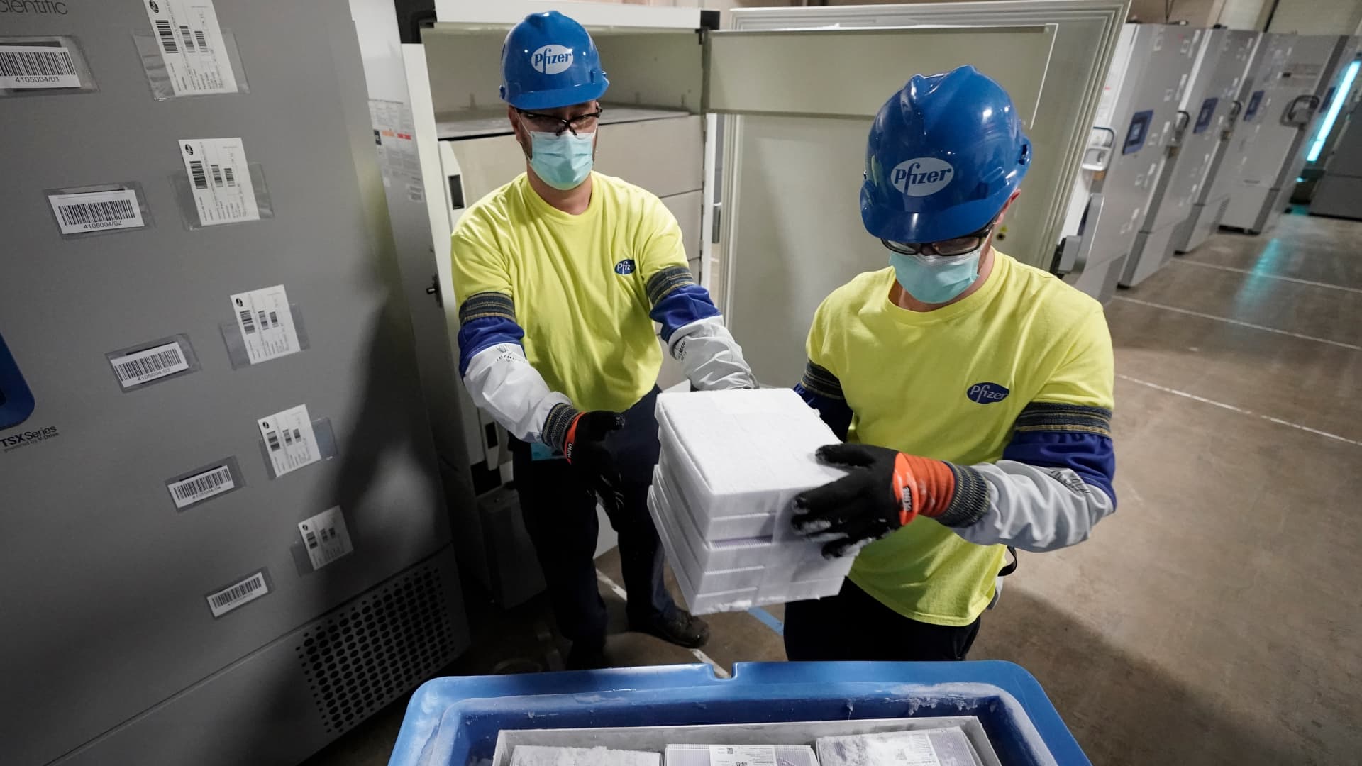 Boxes containing the Pfizer-BioNTech Covid vaccine are prepared to be shipped at the Pfizer Global Supply Kalamazoo manufacturing plant on December 13, 2020 in Portage, Michigan.