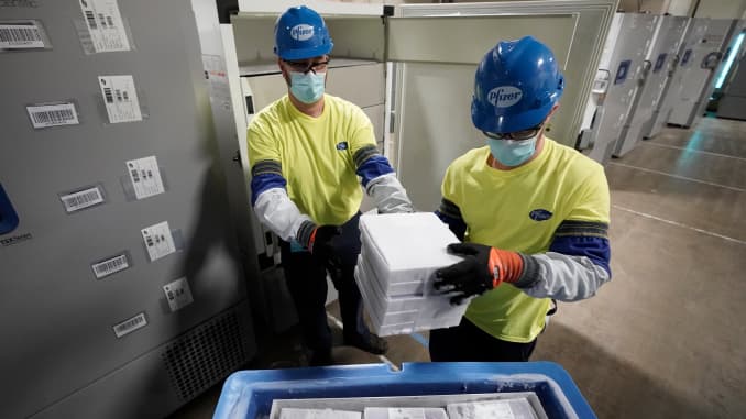 Boxes containing the Pfizer-BioNTech COVID-19 vaccine are prepared to be shipped at the Pfizer Global Supply Kalamazoo manufacturing plant on December 13, 2020 in Portage, Michigan.