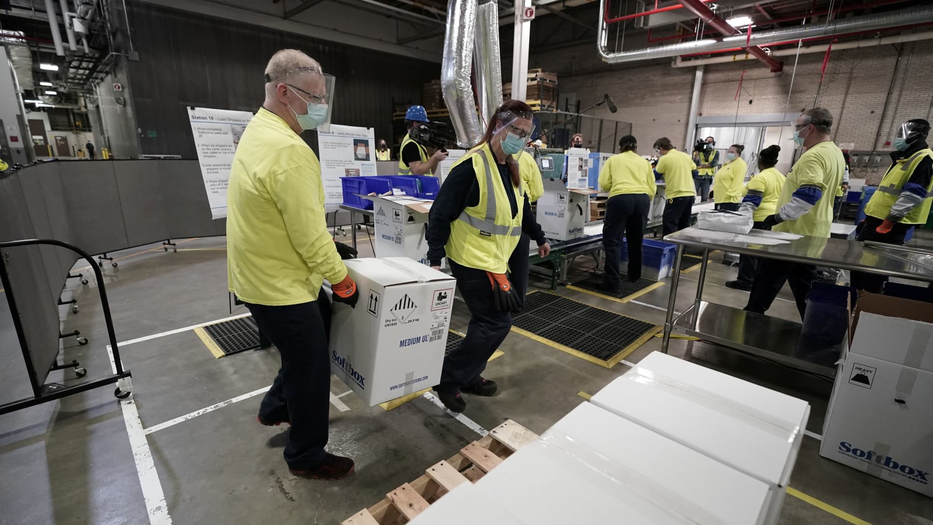 Boxes containing the Pfizer-BioNTech COVID-19 vaccine are prepared to be shipped at the Pfizer Global Supply Kalamazoo manufacturing plant in Portage, Michigan, U.S., December 13, 2020.