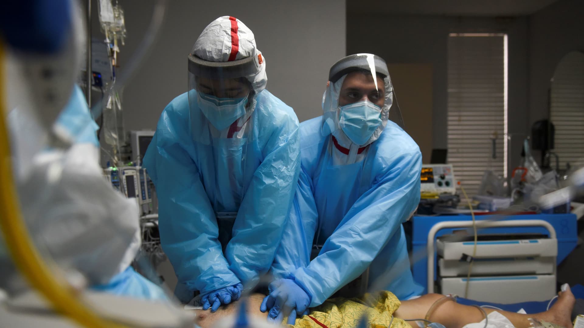 Healthcare personnel perform CPR on a patient inside a coronavirus disease (COVID-19) unit at United Memorial Medical Center as the United States nears 300,000 COVID-19 deaths, in Houston, Texas, U.S., December 12, 2020. Picture taken December 12, 2020.