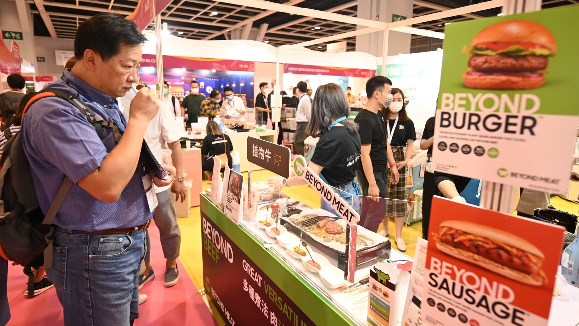 A visitor tries a Beyond Meat plant-based protein substitute at the Restaurant & Bar and Gourmet Asia expo at the Hong Kong Convention and Exhibition Centre in Hong Kong on November 11, 2020.
