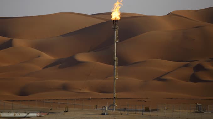 Flames burn off at an oil processing facility in Saudi Aramco's oilfield in the Rub' Al-Khali desert in Shaybah, Saudi Arabia, in October 2018.
