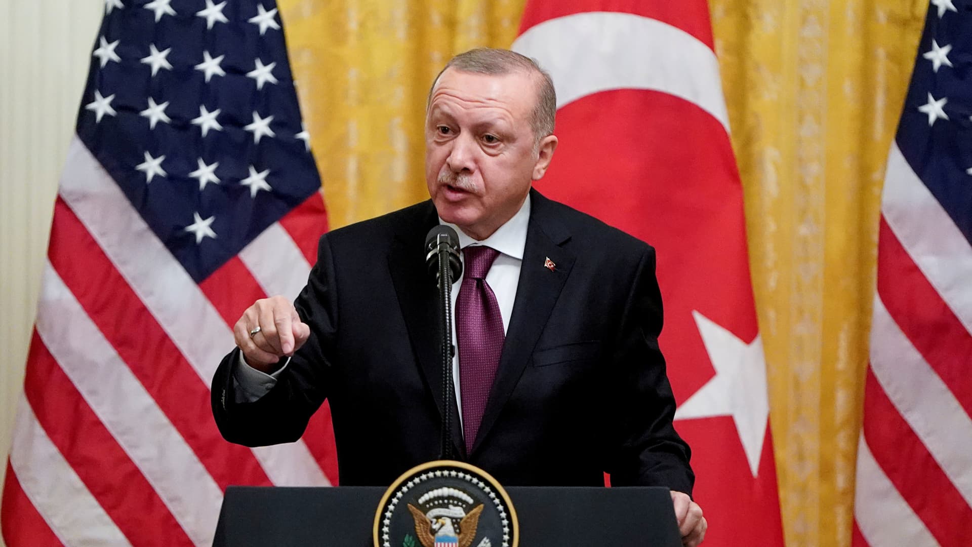 Turkish President Tayyip Erdogan answers questions during a joint news conference with U.S. President Donald Trump at the White House in Washington, U.S., November 13, 2019.