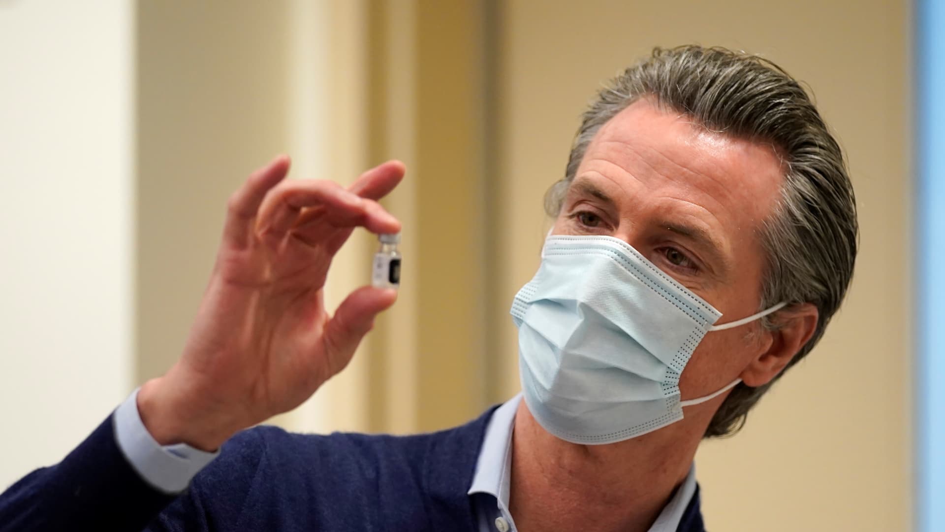Gov. Gavin Newsom holds up a vial of the Pfizer-BioNTech COVID-19 vaccine at Kaiser Permanente Los Angeles Medical Center in Los Angeles, California, U.S. December 14, 2020.