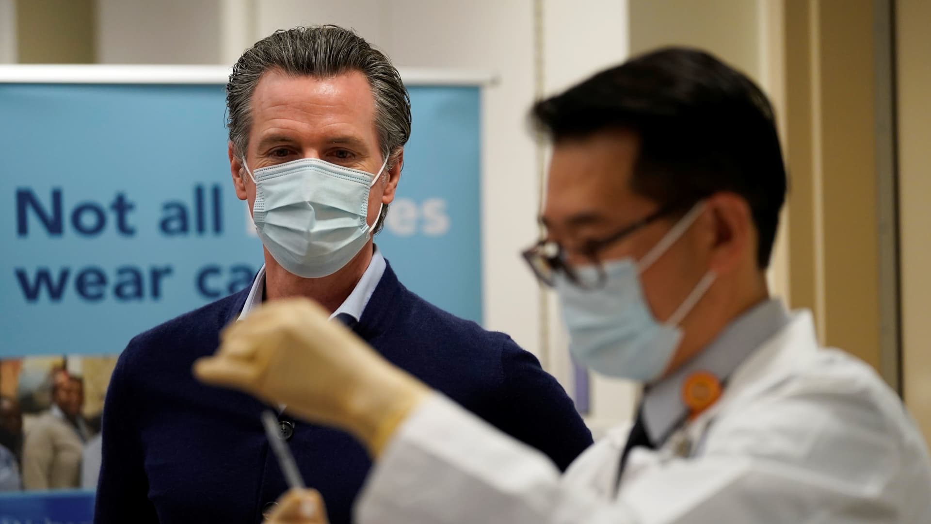 Gov. Gavin Newsom watches as the Pfizer-BioNTech COVID-19 vaccine is prepared by Director of Inpatient Pharmacy David Cheng at Kaiser Permanente Los Angeles Medical Center in Los Angeles, California, U.S. December 14, 2020.