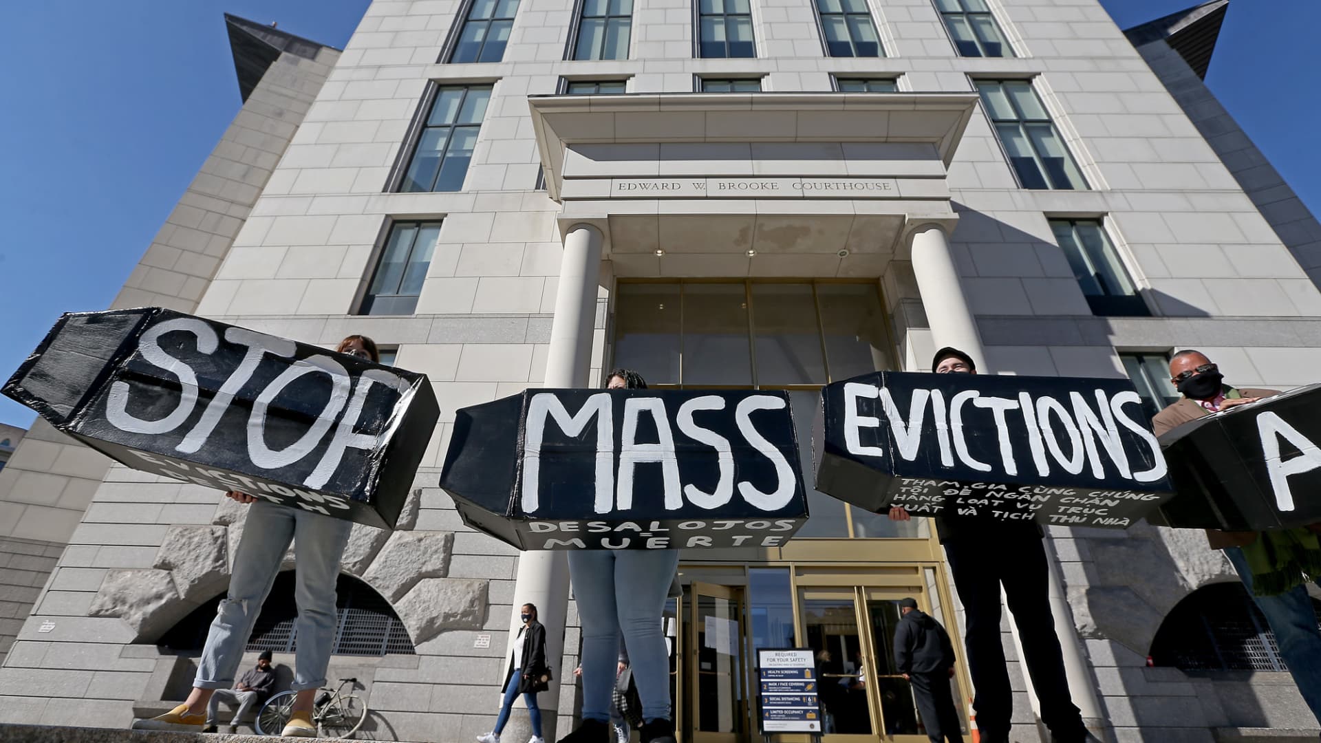 Protester hold a signs during a rally to prevent Massachusetts evictions in front of Boston Housing Court on October 15, 2020 in Boston, Massachusetts.