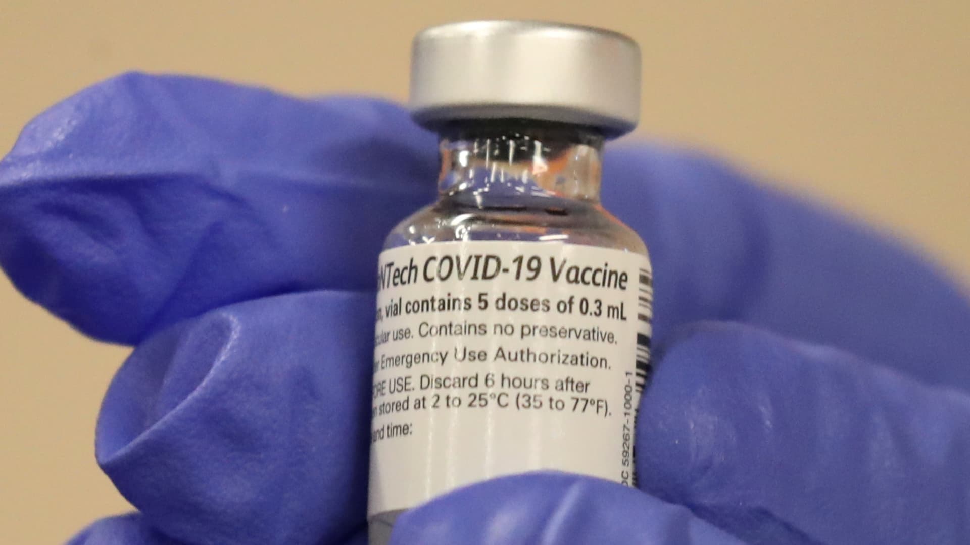 A healthcare worker holds a coronavirus disease (COVID-19) vaccine vial at Dignity Health Glendale Memorial Hospital and Health Center in Glendale, California, U.S., December 17, 2020.