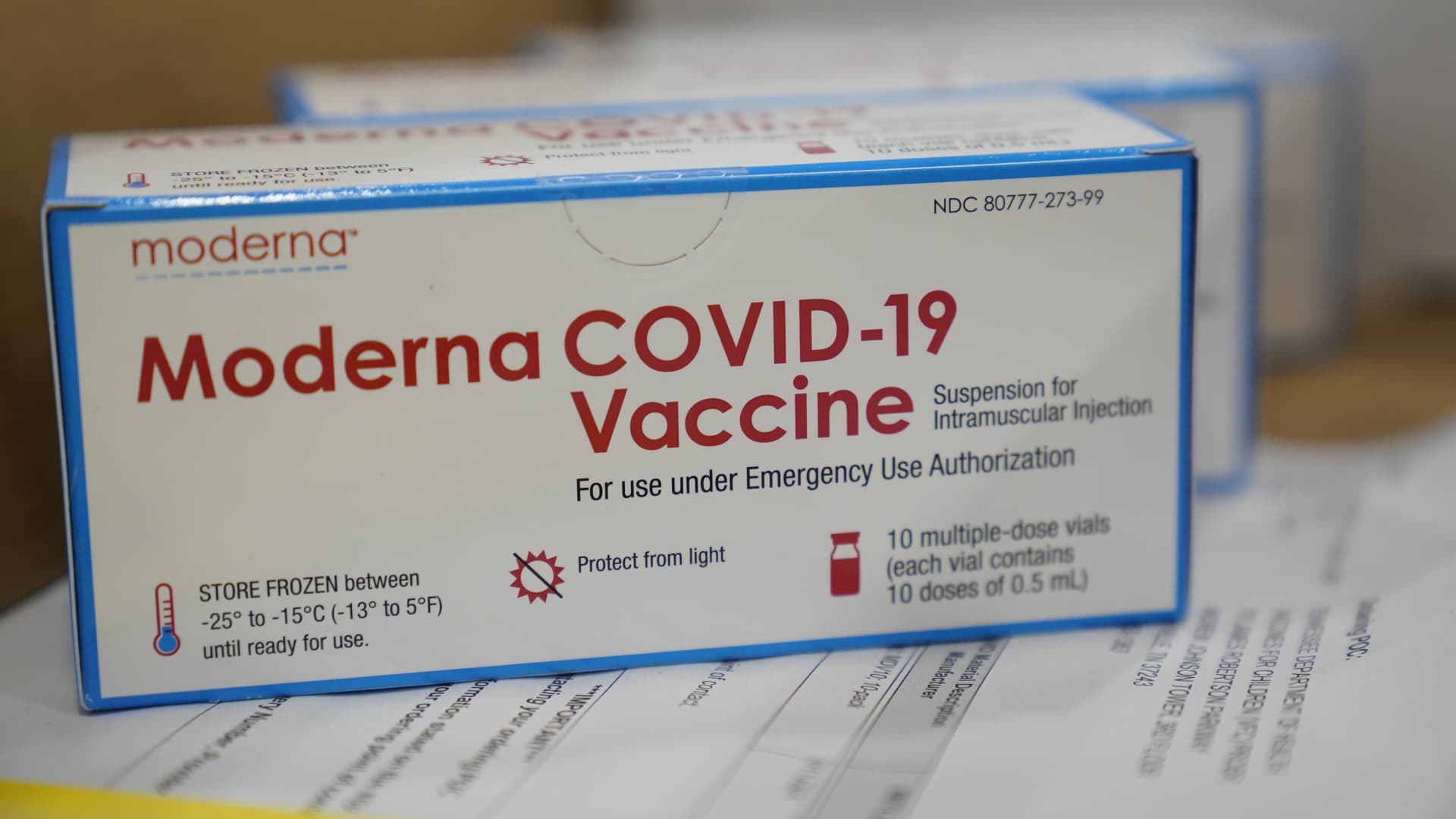 Boxes containing the Moderna COVID-19 vaccine are prepared to be shipped at the McKesson distribution center in Olive Branch, Mississippi.