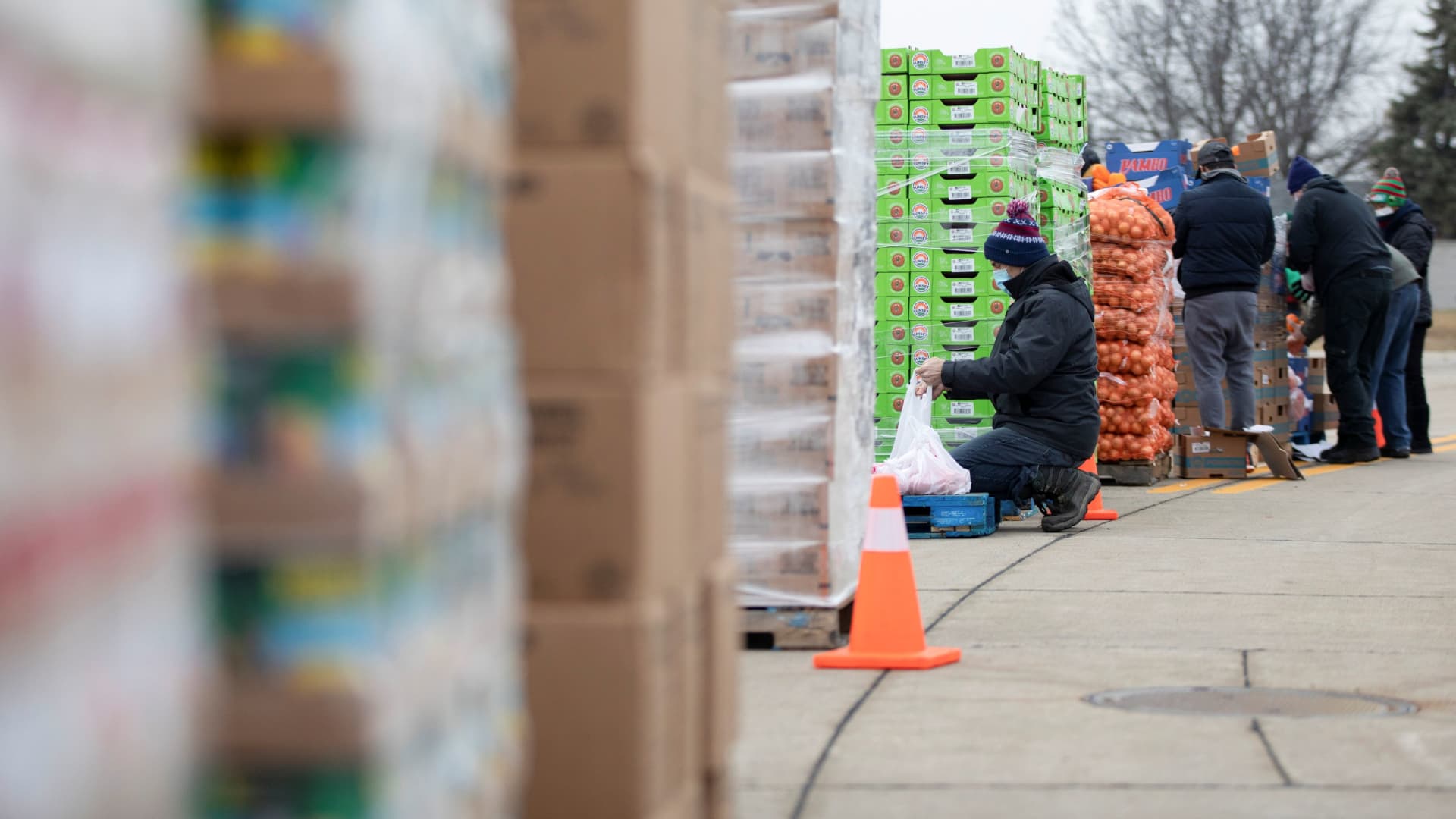 Volunteers from Forgotten Harvest food bank help sort goods to distribute during a mobile food pantry ahead of Christmas, amid the coronavirus disease (COVID-19) pandemic in Warren, Michigan, U.S., December 21, 2020.