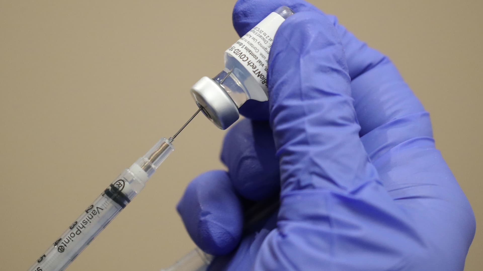 A healthcare worker draws the coronavirus disease (COVID-19) vaccine from a vial at Dignity Health Glendale Memorial Hospital and Health Center in Glendale, California, December 17, 2020.