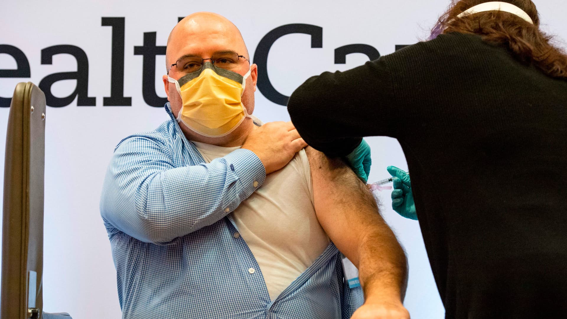 Michael Girard recieves the Covid-19 vaccine with the first batch of Moderna's vaccine at Hartford hospital in Hartford, Connecticut on December 21, 2020. arrival of the vaccine.