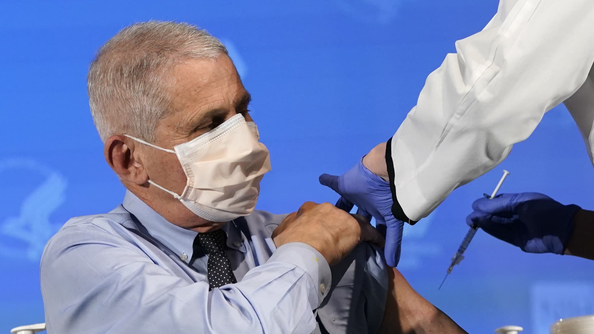 Anthony Fauci, director of the National Institute of Allergy and Infectious Diseases, receives the Moderna Inc. Covid-19 vaccine during an event at the NIH Clinical Center Masur Auditorium in Bethesda, Maryland, U.S., on Tuesday, Dec, 22, 2020.