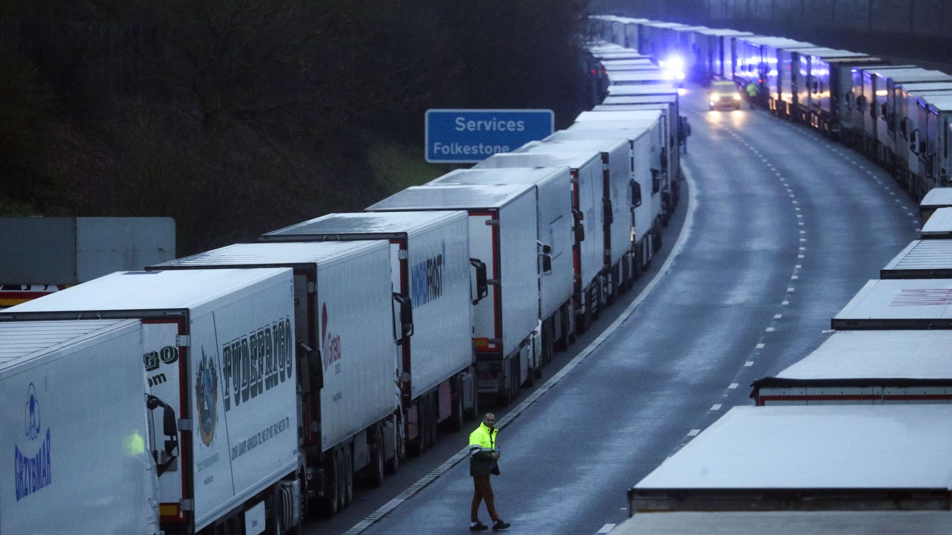 A drive sits in the cab of his lorry while parked on the M20 in Kent after the Port of Dover was closed after the French government's announcement it will not accept any passengers arriving from the UK.