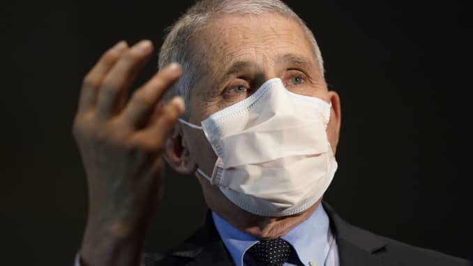 Anthony Fauci, director of the National Institute of Allergy and Infectious Diseases, speaks with Alex Azar, secretary of Health and Human Services (HHS), not pictured, before they receive the Moderna Inc. Covid-19 vaccine during an event at the NIH Clinical Center Masur Auditorium in Bethesda, Maryland, U.S., on Tuesday, Dec, 22, 2020. The National Institutes of Health is holding a livestreamed vaccination event to kick-off the organization's efforts for its employees on the front line of the pandemic. Photographer: Patrick Semansky/Associated Press/Bloomberg via Getty Images