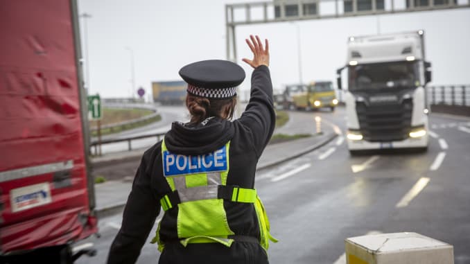 Police manage freight lorry drivers as the French border closures due to a new strain of COVID-19 at the entrance into the port of Dover in the Eastern Dock where the cross channel port is situated with ferries departing to go to Calais in France on the 2