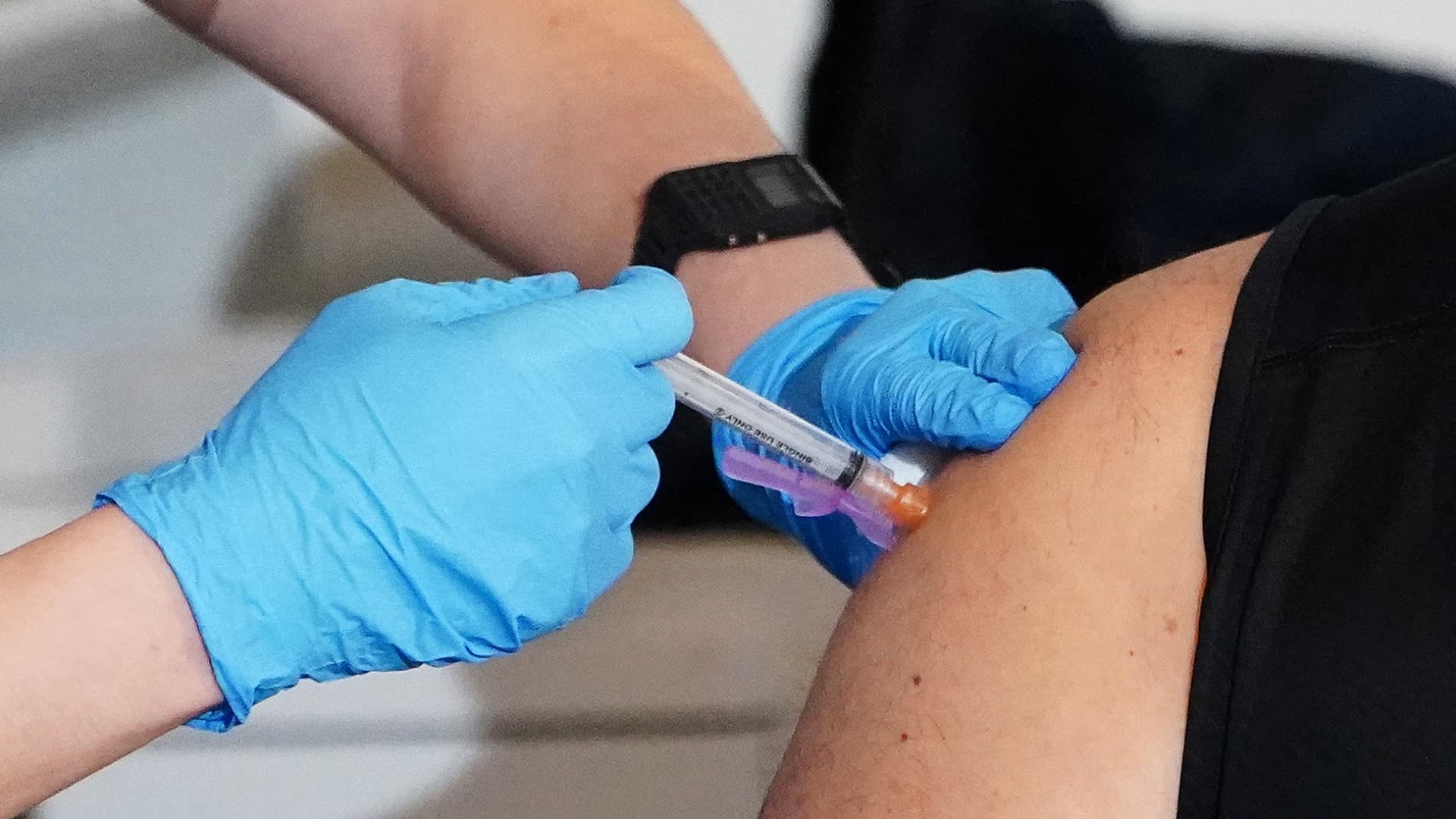 A worker of the New York City Fire Department Bureau of Emergency Medical Services (FDNY EMS) receives a COVID-19 Moderna vaccine, amid the coronavirus disease (COVID-19) pandemic in New York, December 23, 2020.