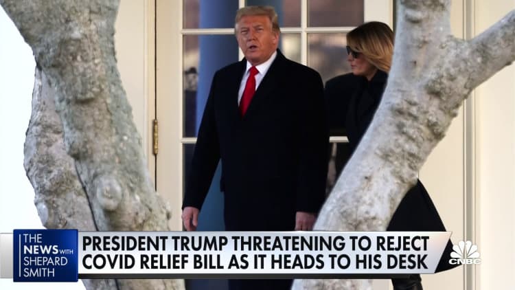 Covid relief bill on the rocks as Trump threatens veto