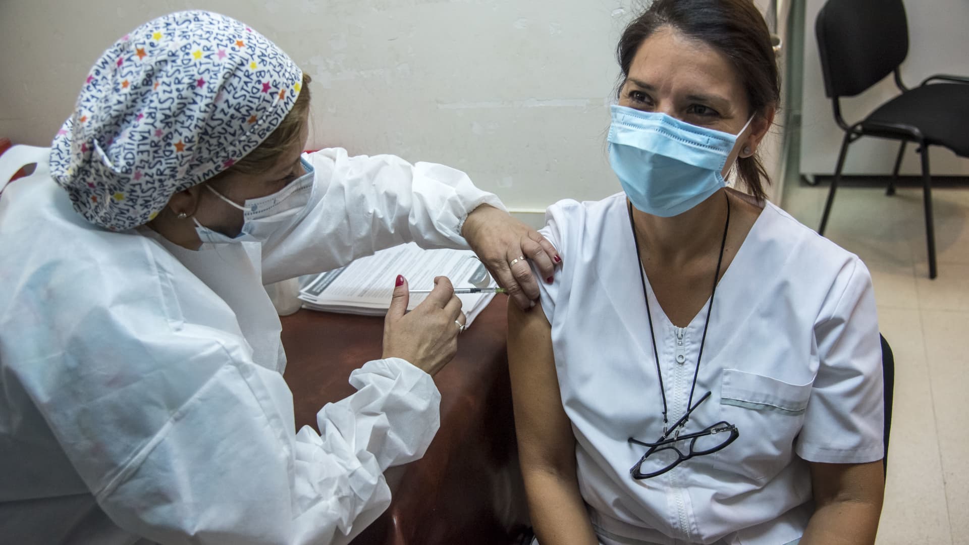 A health worker gets the Sputnik V vaccine at the Centenario Hospital in Rosario, Santa Fe Province, as the vaccination campaign against the novel coronavirus Covid-19 started in Argentina, on Dec. 29, 2020.