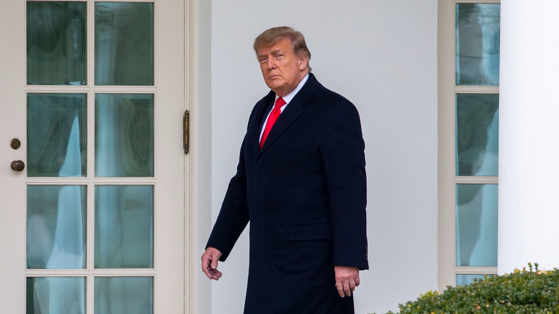 U.S. President Donald Trump walks to the Oval Office while arriving back at the White House on December 31, 2020 in Washington, DC.