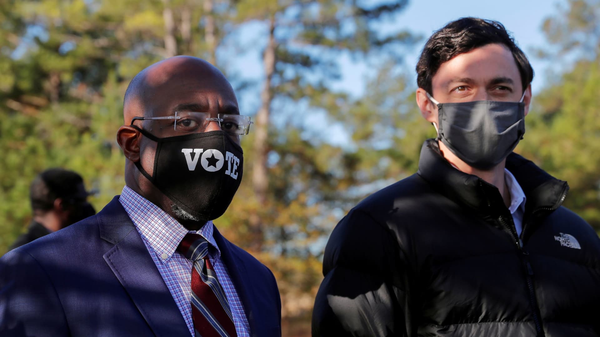 Democratic U.S. Senate candidates Jon Ossoff and Rev. Raphael Warnock look on as they appear together at a campaign rally ahead of U.S. Senate runoff elections in Augusta, Georgia, U.S. January 4, 2021.