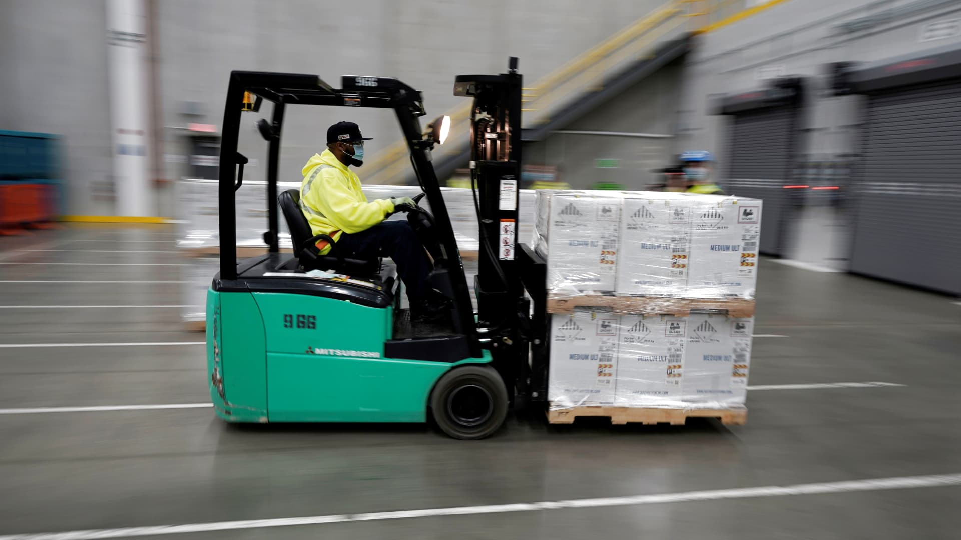 Boxes containing the Pfizer-BioNTech COVID-19 vaccine are prepared to be shipped at the Pfizer Global Supply Kalamazoo manufacturing plant in Portage, Michigan, December 13, 2020.