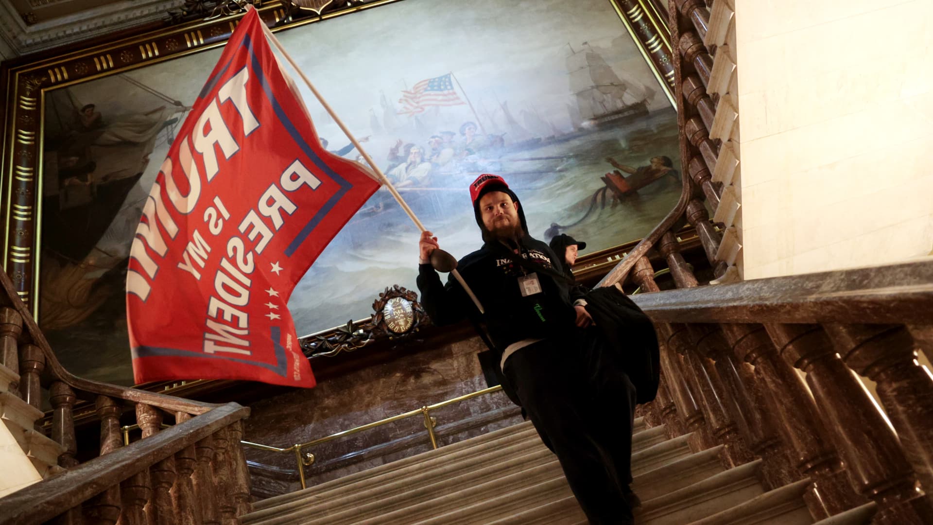 A protester holds a Trump flag inside the US Capitol Building near the Senate Chamber on January 06, 2021 in Washington, DC.