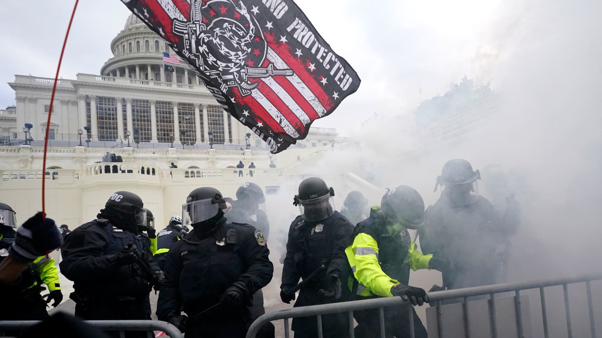 Police hold off Trump supporters who tried to break through a police barrier, Wednesday, Jan. 6, 2021, at the Capitol in Washington.
