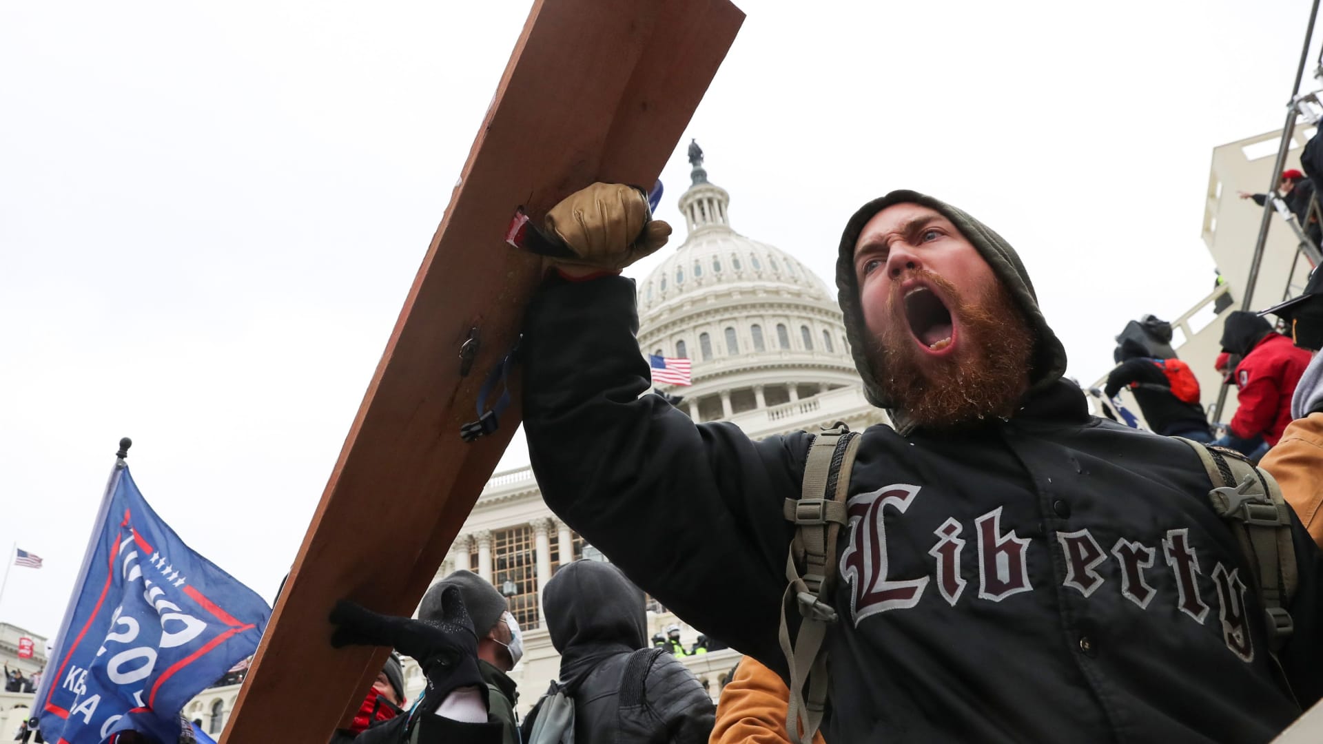 A man shouts as supporters of U.S. President Donald Trump gather in front of the U.S. Capitol Building in Washington, January 6, 2021.