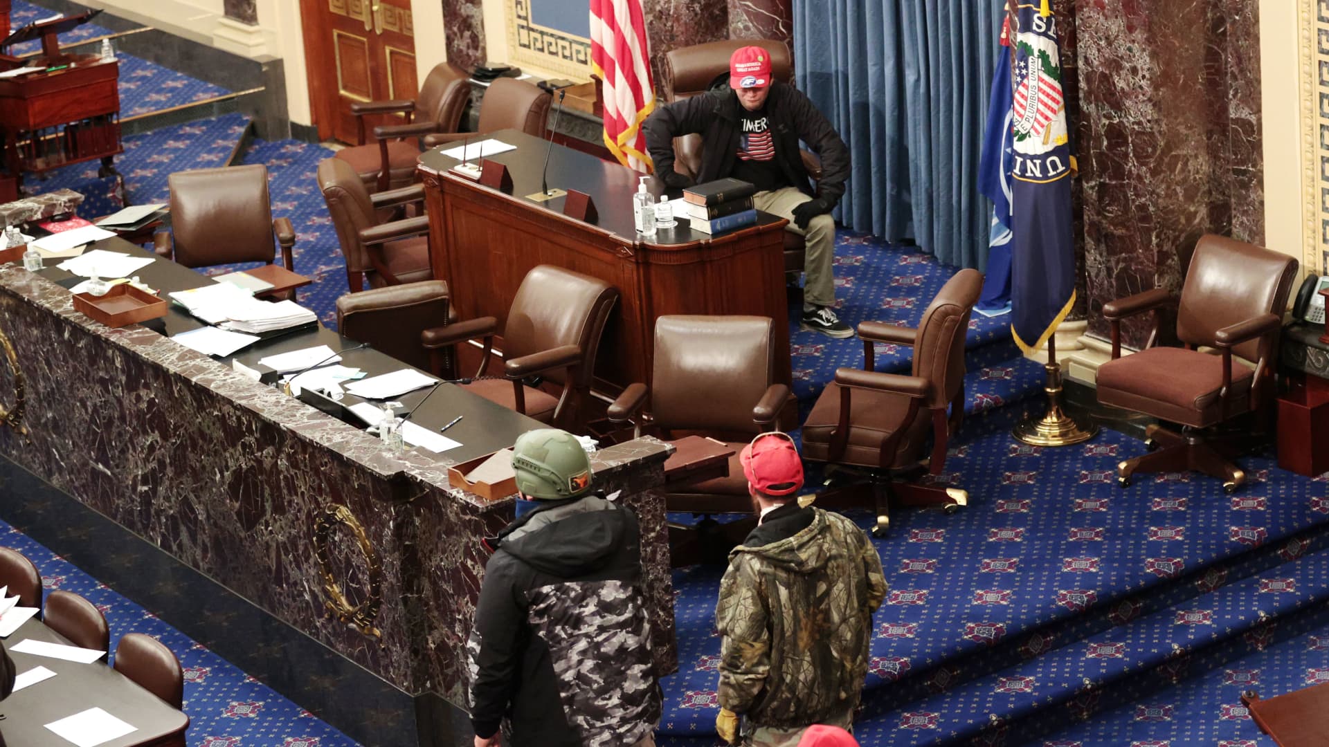 Protesters enter the Senate Chamber on January 06, 2021 in Washington, DC. Congress held a joint session today to ratify President-elect Joe Biden's 306-232 Electoral College win over President Donald Trump.