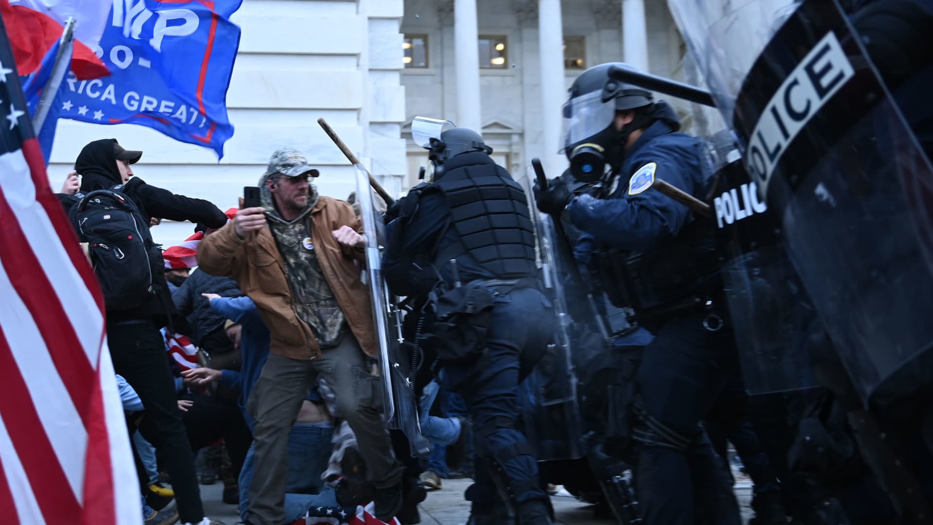 Trump supporters clash with police and security forces, as they storm the US Capitol in Washington, DC, on January 6, 2021.