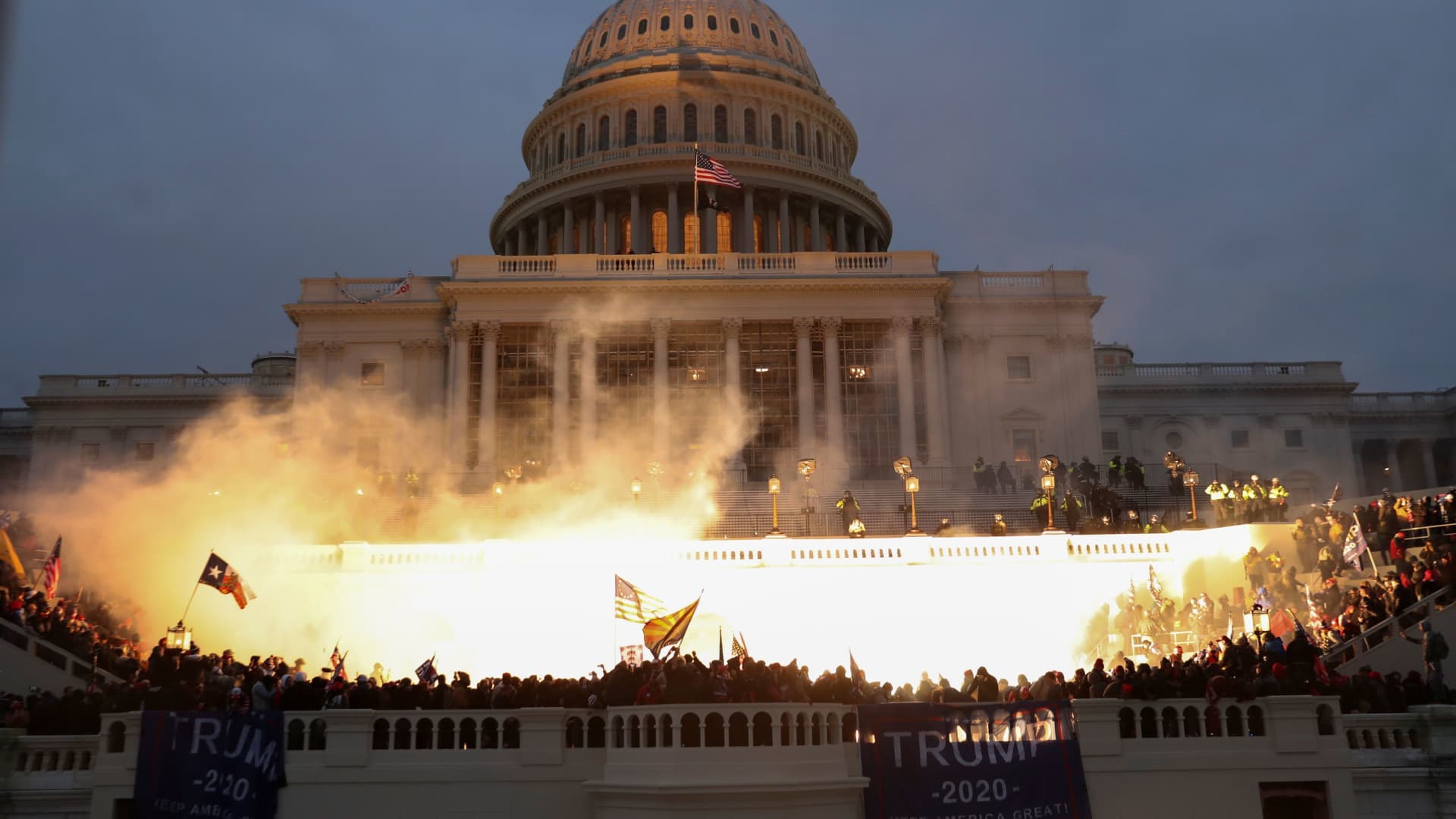 An explosion caused by a police munition is seen while supporters of U.S. President Donald Trump gather in front of the U.S. Capitol Building in Washington, U.S., January 6, 2021.