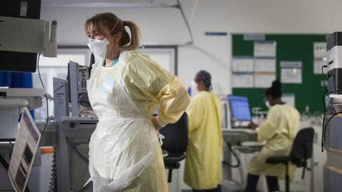 A nurse adjusts her PPE in the ICU (Intensive Care Unit) in St George's Hospital in Tooting, south-west London, where the number of intensive care beds for the critically sick has had to be increased from 60 to 120, the vast majority of which are for coronavirus patients.