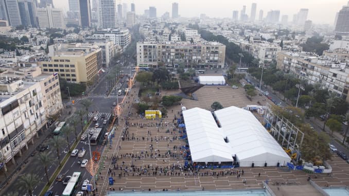 People queue outside a Covid-19 mass vaccination center at Rabin Sqaure in this aerial photograph taken in Tel Aviv, Israel, on Monday, Jan. 4, 2020. Israel plans to vaccinate 70% to 80% of its population by April or May, Health Minister Yuli Edelstein has said.