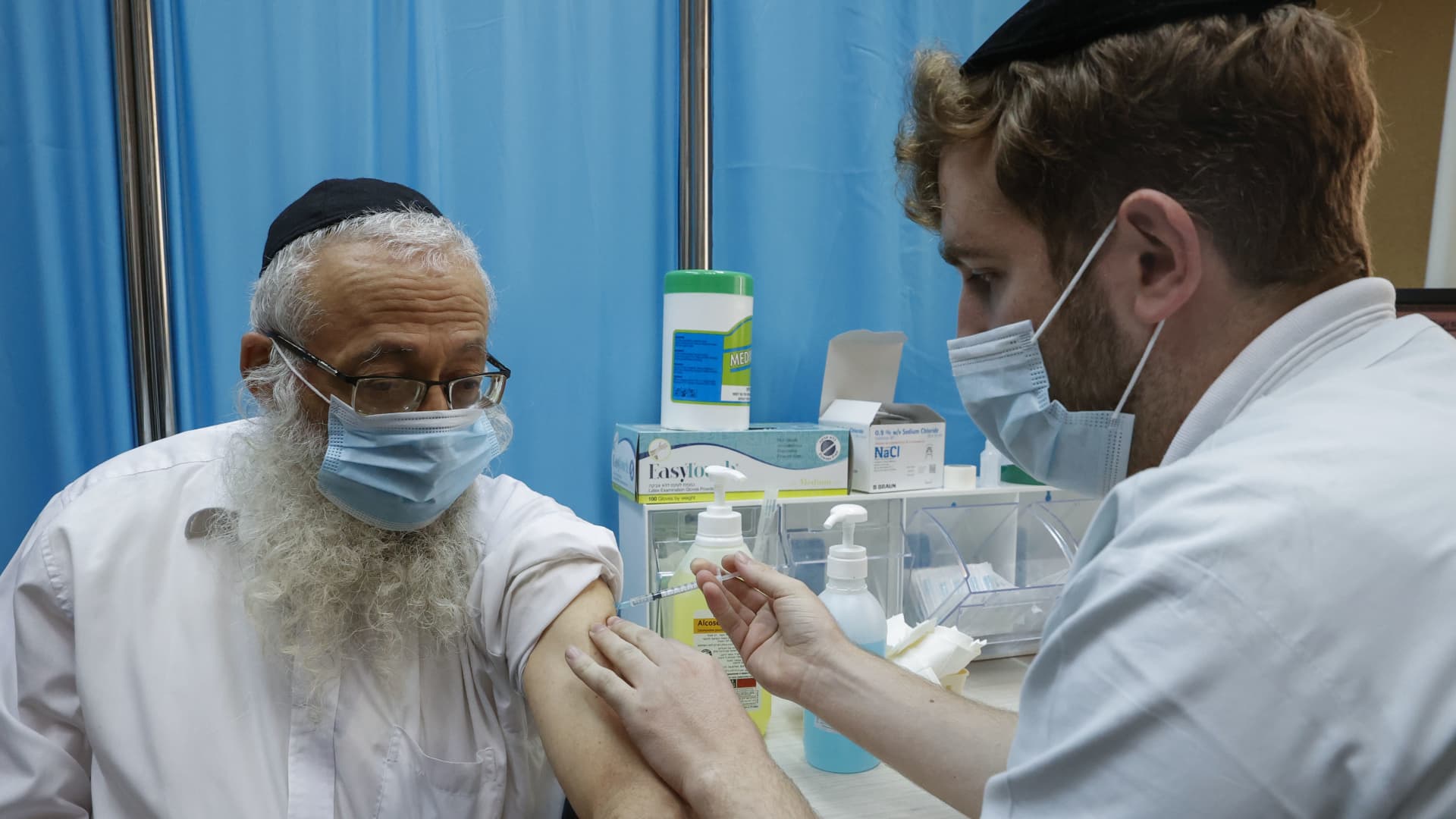 A healthcare worker administers a Covid-19 vaccine at Clalit Health Services, in the ultra-Orthodox Israeli city of Bnei Brak, on January 6, 2021.