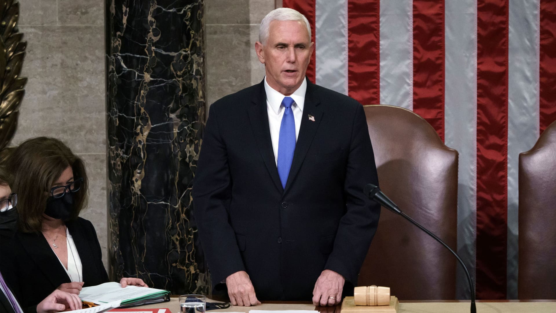 U.S. Vice President Mike Pence reads the final certification of Electoral College votes cast in November's presidential election during a joint session of Congress after working through the night, at the Capitol in Washington, January 7, 2021.