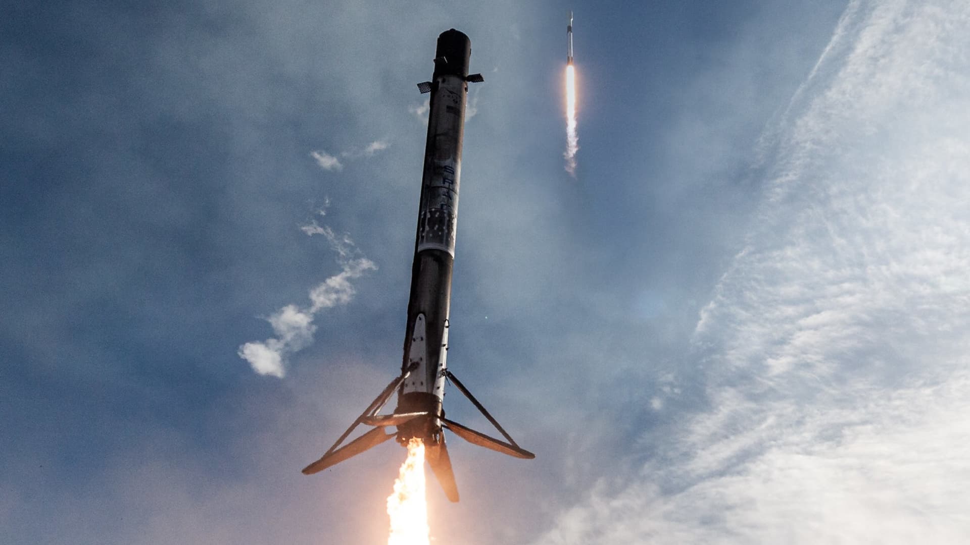 A composite image showing a Falcon 9 rocket booster lifting off and a few minutes later landing back near the launchpad.
