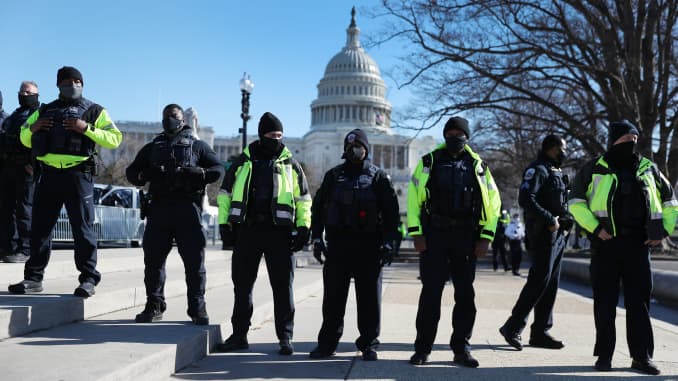 Members of the Metropolitan Police Department of the District of Columbia are seen in front of the U.S. Capitol a day after a pro-Trump mob broke into the building on January 07, 2021 in Washington, DC.