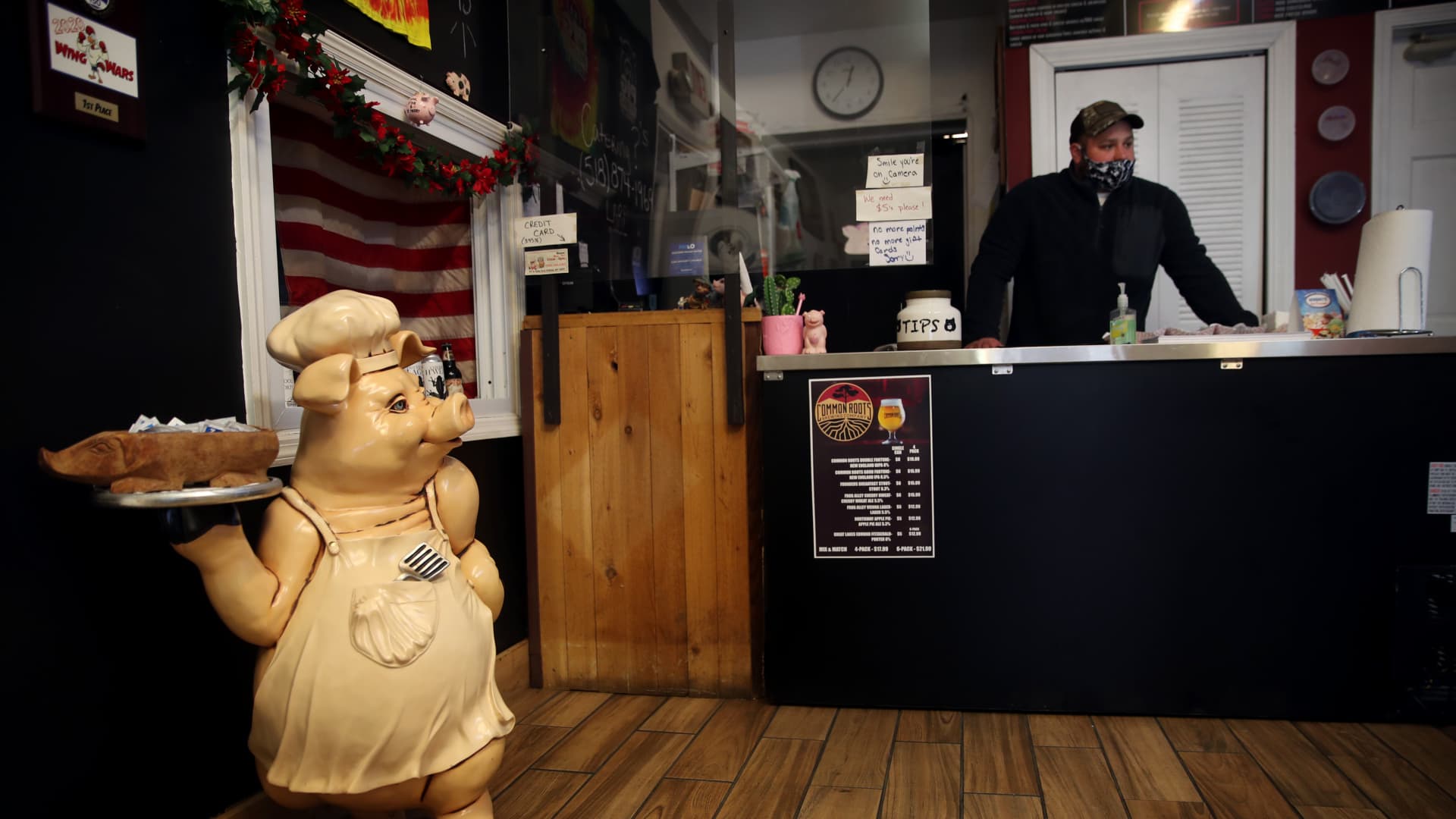 Manager Pat Ryan stands at the counter at the Pig Pit BBQ in Cohoes, NY on December 09, 2020. The pandemic crushed businesses on Boston's Water Street.