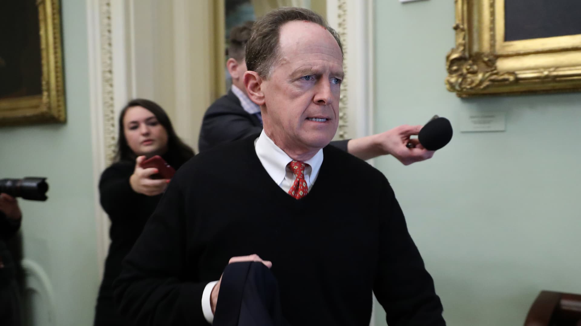 Sen. Pat Toomey (R-PA) quickly walks past reporters as he arrives for the weekly Senate Republican policy luncheon at the U.S. Capitol January 21, 2020 in Washington, DC.
