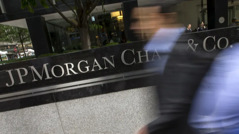 People pass the JP Morgan Chase & Co. Corporate headquarters in the Manhattan borough of New York City.