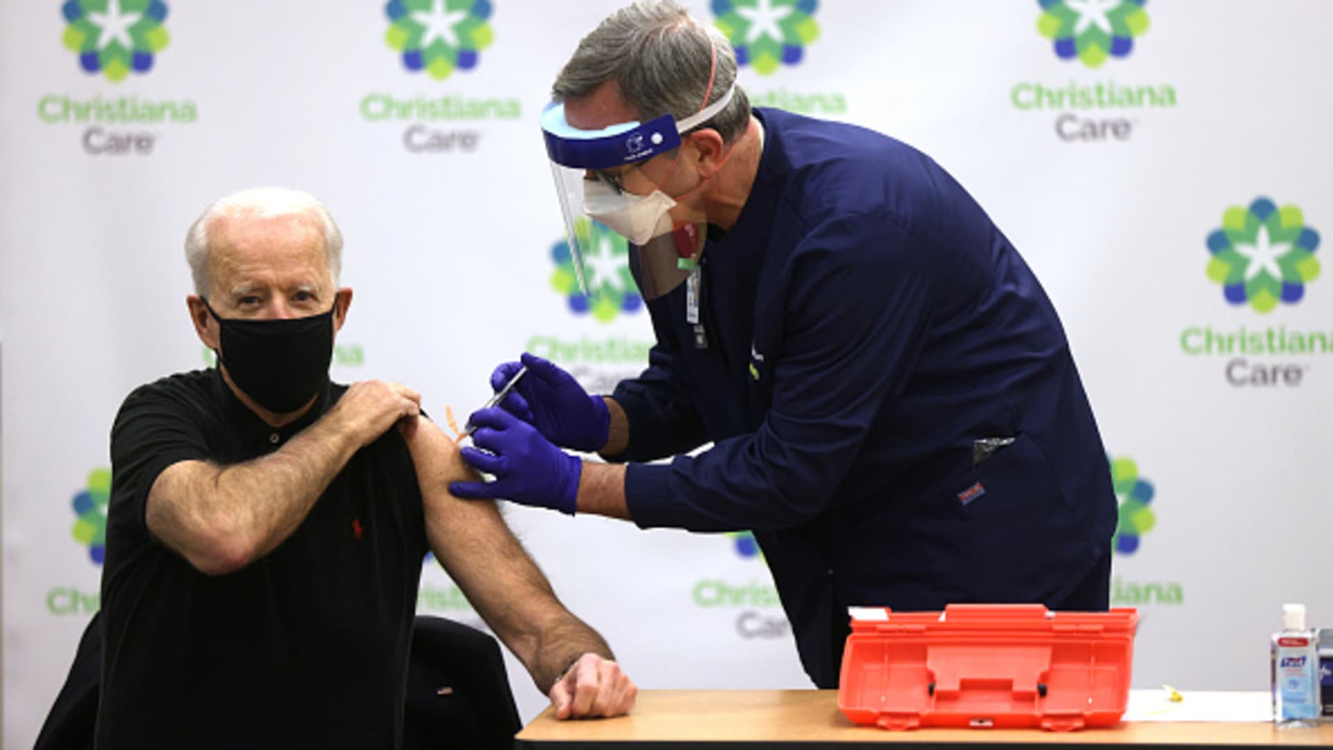 President-elect Joe Biden (L) receives the second dose of a COVID-19 Vaccination from Chief Nurse Executive Ric Cuming (R) at ChristianaCare Christiana Hospital on January 11, 2021 in Newark, Delaware.